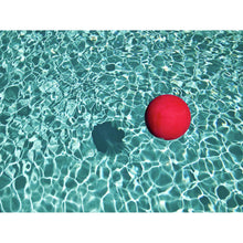 Load image into Gallery viewer, Floating Red Ball In Blue Rippled Water By Mark A Paulda Framed Print
