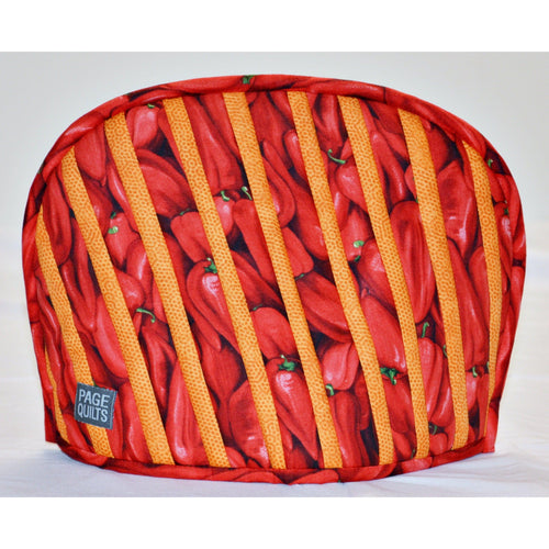 Page Quilts tea cozy orange dotted-stripe and red chili pepper pattern